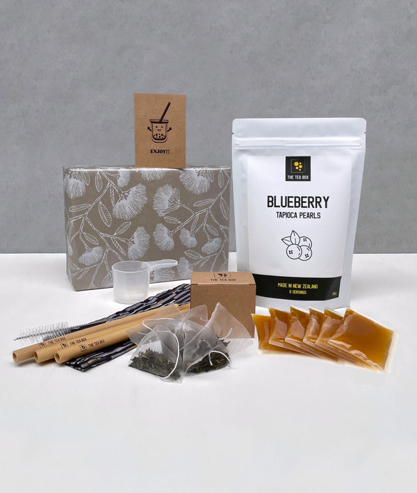 6 pack Lychee Bubble Tea gift pack. Blueberry tapioca fruit pearls, sachets of Lychee fruit mix, jasmine green tea bags, 3 bamboo bubble tea straws with drawstring bag, scoop, greeting card, wrapped gift box