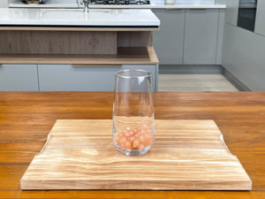 Serving glass holding cooked Red Grapefruit tapioca fruit pearls