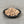 Load image into Gallery viewer, Uncooked Brown tapioca pearls in a small black ceramic dish