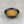 Load image into Gallery viewer, Small black ceramic dish filled with light orangey yellow Lychee fruit mix