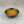 Load image into Gallery viewer, Small black ceramic dish filled with light orange Lychee and Passionfruit fruit mix