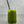 Load image into Gallery viewer, A glass of vibrant green Matcha Yuzu Bubble tea with Blueberry pearls, ice and a silver stainless steel bubble tea straw