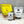 Load image into Gallery viewer, Contents of 6 pack Matcha Yuzu Bubble Tea Kit. Matcha powder and Blueberry pearls in pouches, bottle of yellow Yuzu fruit mix, scoop, cardboard gift box
