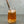Load image into Gallery viewer, A glass of Red Grapefruit Bubble Tea with Yuzu tapioca fruit pearls, ice and a rose gold stainless steel bubble tea straw