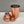 Load image into Gallery viewer, Unassembled rose gold 3-piece shaker with a shiny brushed finish in traditional cobbler style. Showing the cup, strainer and cap