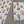 Load image into Gallery viewer, Cactus gift wrapping paper. Multicoloured cartoon cacti wearing hats and sunglasses on a white background