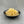 Load image into Gallery viewer, Cooked, yellow Yuzu tapioca fruit pearls in a small black ceramic dish