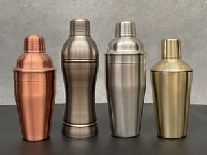 Stainless Steel Cocktail Shakers range. All 3 pieces with cup, strainer and lid. Rose gold, dark grey, silver and gold 
