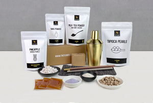 9 pack starter kit with stainless steel cocktail shaker and metal straws. Pouches of pineapple fruit pearls, taro powder, milk tea powder, fruit mix and brown tapioca pearls. Creates 3 servings of our 3 best-selling bubble tea flavours.