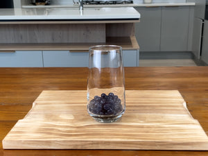 Cooked dark purple Blueberry tapioca fruit pearls in a serving glass