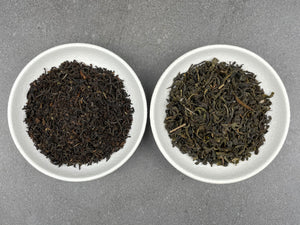 2 white ceramic dishes filled with loose tea leaves. Our English Breakfast black tea and our Jasmine green tea