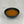 Load image into Gallery viewer, Small black ceramic dish filled with orange mango fruit mix
