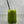 Load image into Gallery viewer, A glass of vibrant green Matcha Yuzu Bubble tea with Blueberry pearls, ice and a silver stainless steel bubble tea straw
