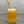 Load image into Gallery viewer, A glass of Passionfruit Bubble Tea with Pineapple tapioca fruit pearls, ice and a reusable bamboo bubble tea straw
