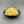 Load image into Gallery viewer, Cooked, yellow Pineapple tapioca fruit pearls in a small black ceramic dish
