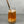 Load image into Gallery viewer, A glass of Red Grapefruit Bubble Tea with Yuzu pearls, ice and a rose gold stainless steel straw
