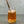 Load image into Gallery viewer, A glass of Red Grapefruit Bubble Tea with Yuzu tapioca fruit pearls, ice and a rose gold stainless steel bubble tea straw
