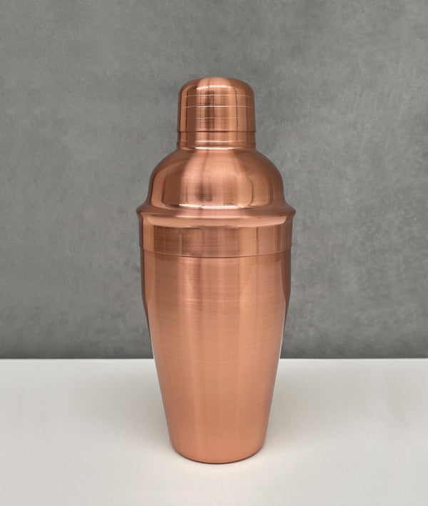 Rose gold 3-piece stainless steel cocktail shaker with a shiny brushed finish in traditional cobbler style