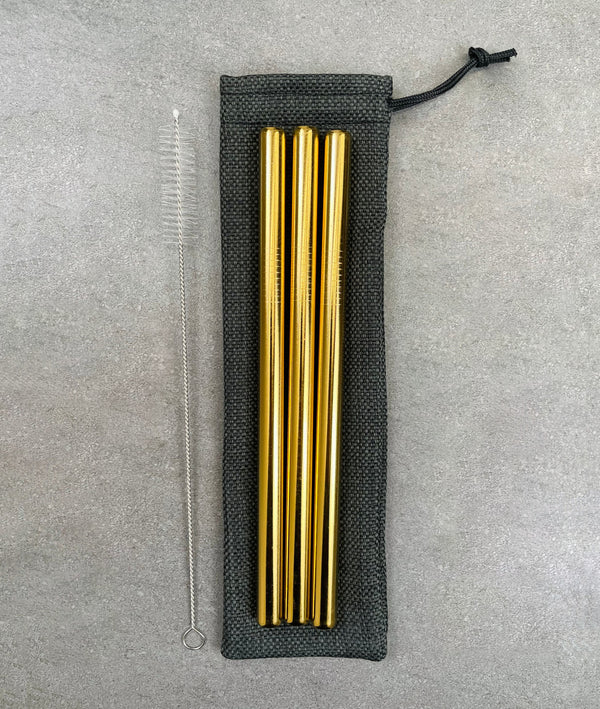 3 pack of stainless steel bubble tea straws, in gold. Cleaning brush with nylon bristles and a drawstring bag
