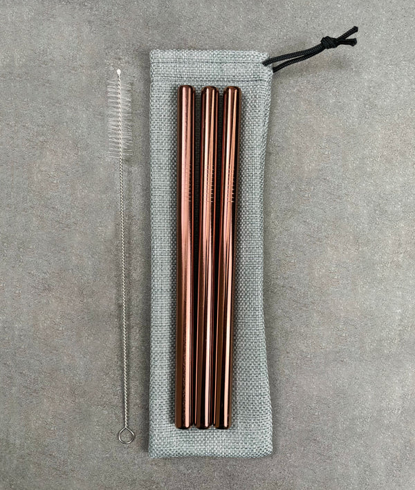 3 pack of stainless steel bubble tea straws, in rose gold. Cleaning brush with nylon bristles and a drawstring bag