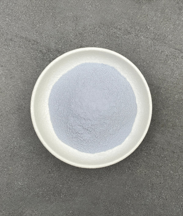 Light purple Taro powder in a white ceramic dish