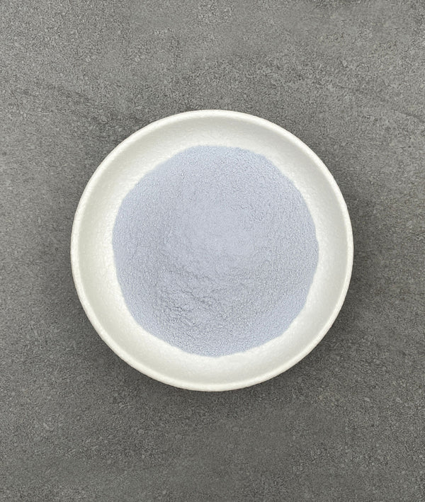 Light purple Taro powder in a white ceramic dish